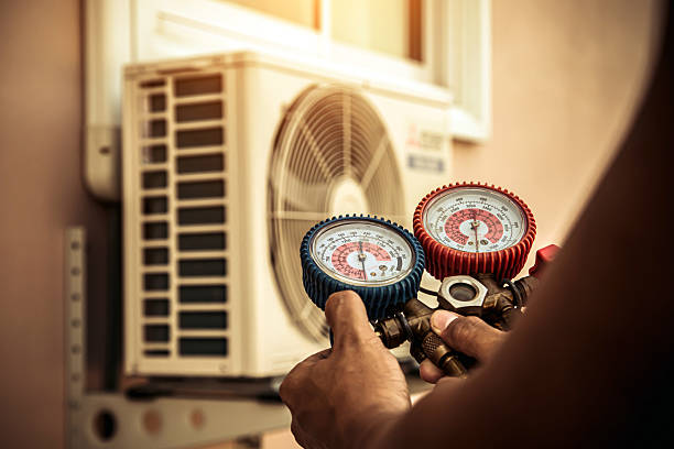 Professional Heat Pump Repair technician working in Siloam Springs, AR
